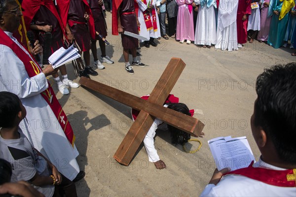 Christian devotees during the annual Good Friday procession to re-enact the crucifixion of Jesus Christ on April 7