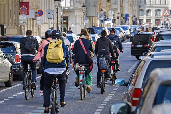 Symbolic photo on the subject of bicycle lanes in the city. Cyclists ride on the bicycle street in Linienstrasse in Berlin Mitte. Berlin