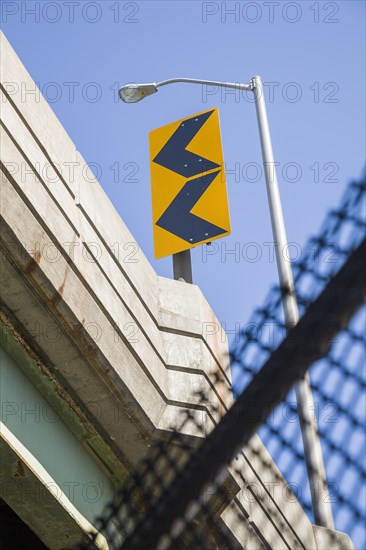 Traffic sign on a highway overpass