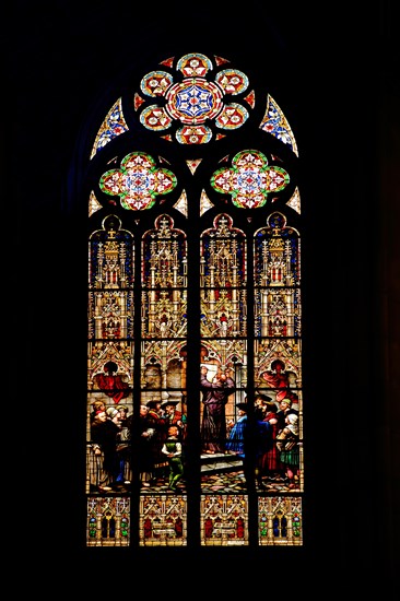 Stained glass window with Martin Luther's posting of 95 theses at the castle church in Wittenberg