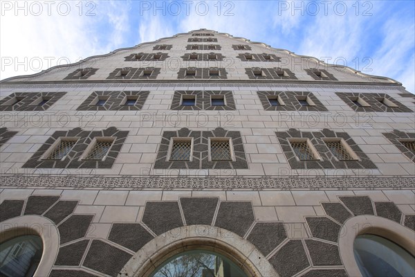 Historic Renaissance granary with sgraffiti and ornaments looking up