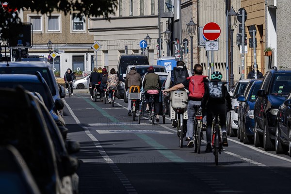 Symbolic photo on the subject of bicycle lanes in the city. Cyclists ride on the bicycle street in Linienstrasse in Berlin Mitte. Berlin