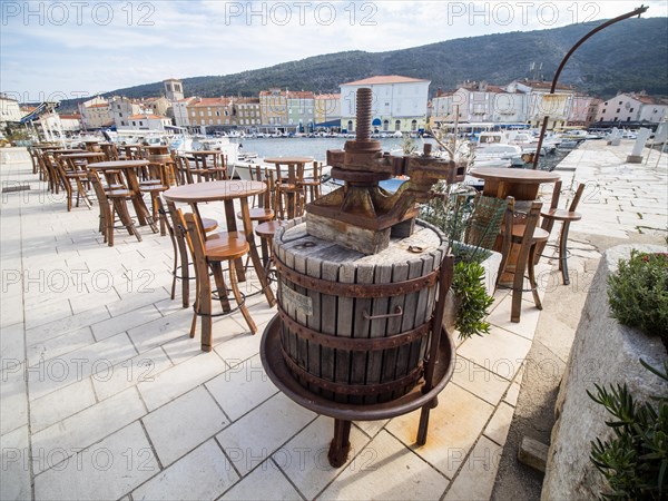 Harbour promenade with restaurant tables