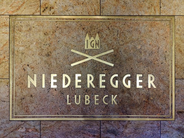 Niederegger company logo on the floor in the entrance area