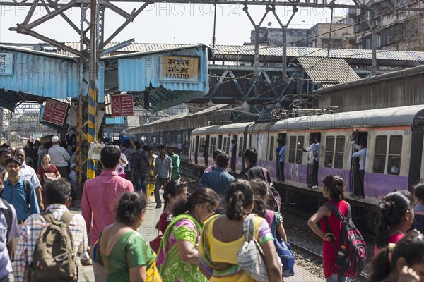 Crowded trains and passengers at MASJID STATION of the Central Line