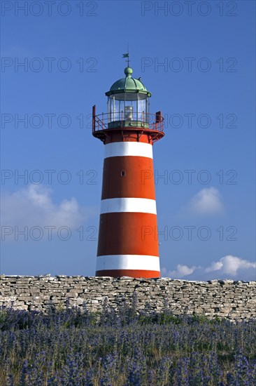 The red and white lighthouse Naers fyr at Naersholmen on the island Gotland