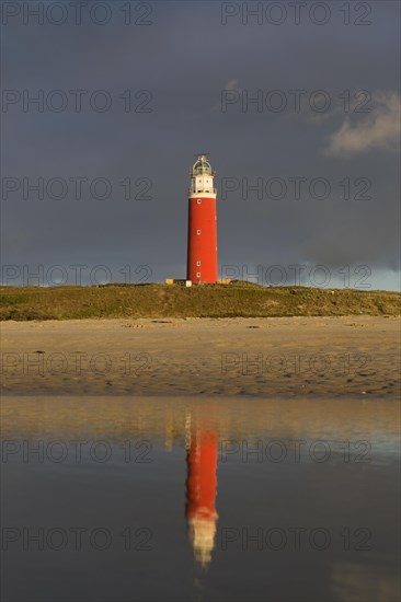 Eierland Lighthouse in the dunes during stormy weather on the northernmost tip of the Dutch island of Texel