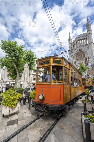 Historical tramway Tren de Soller and church Parroquia de Sant Bartomeu de Soller