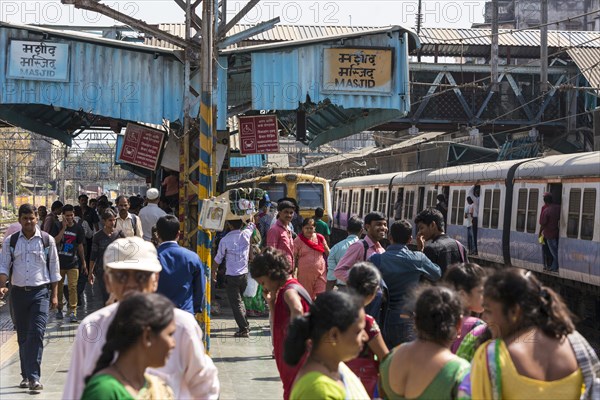 Crowded trains and passengers at MASJID STATION of the Central Line