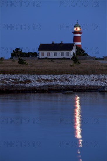 The red and white lighthouse Naers fyr at Naersholmen on the island Gotland