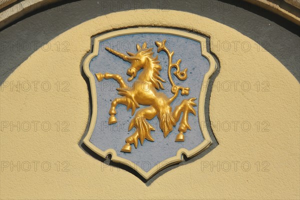 City coat of arms with golden unicorn on the town hall