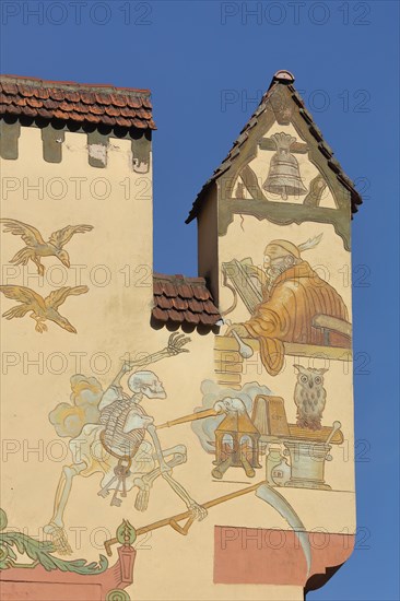 Gable with mural of the Grim Reaper and death bell with symbol of death at the historic Deer Apotheke