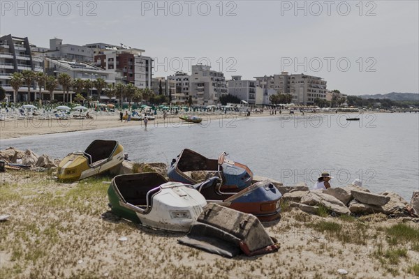 Broken bumper cars standing on the beach of Durres