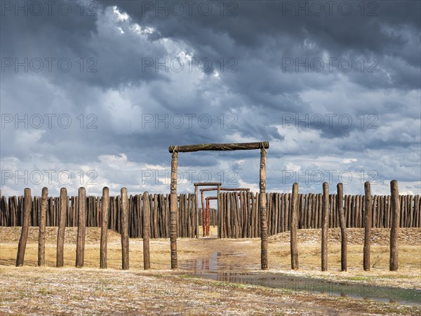 Dark clouds after hailstorm over the circular burial site of Poemmelte