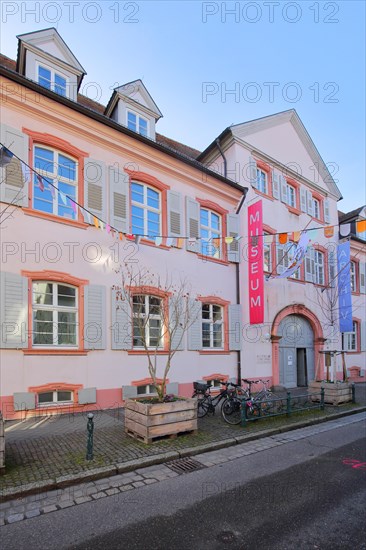 Entrance with banner to the museum and classicist knight's house built in 1784