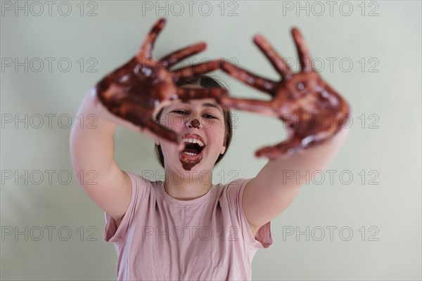 Girl with a chocolate-smeared mouth