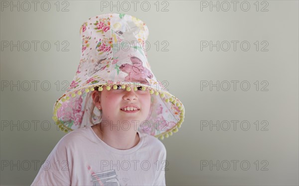 Girl with a lampshade on her head