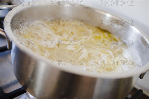 Symbol photo on the subject of cooking pasta. Cooking spaghetti in a saucepan. Berlin