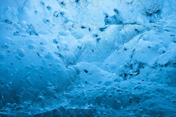 Blue ice mixed with volcanic ash in ice cavern inside Breidamerkurjokull