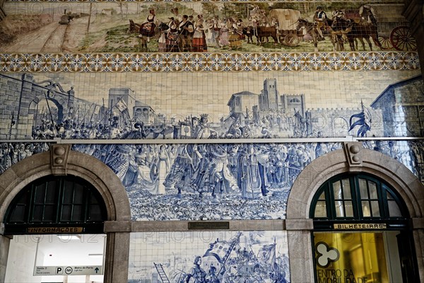 View of azulejos on walls of ornate interior of Arrivals Hall at Sao Bento Railway Station in Porto