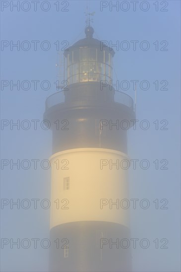 The lighthouse phare de Chassiron in the mist at Saint-Denis-dOleron on the island Ile dOleron