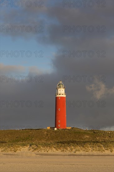 Eierland Lighthouse in the dunes during stormy weather on the northernmost tip of the Dutch island of Texel