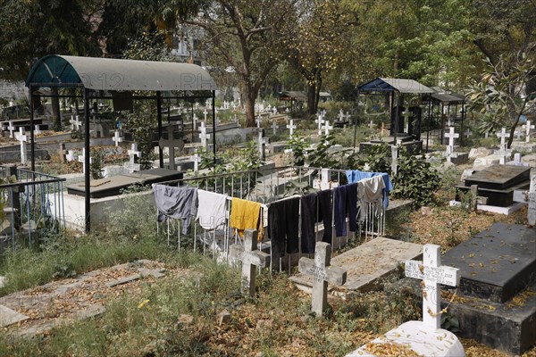 Laundry drying in the sun on a grave in the Indian Christian Cemetery