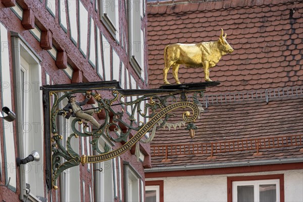 Nose sign with bull figure on half-timbered house Hotel Restaurant Ochsen