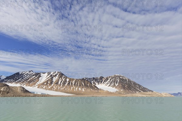 Altocumulus cloud formation over mountains at Bjornfjorden