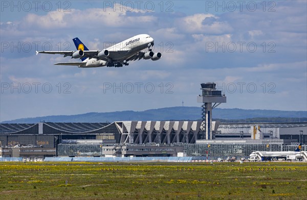 Airbus A380-800 of the airline Lufthansa taking off at Fraport Airport