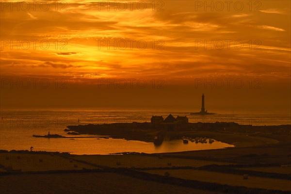 Lighthouse and lifeboat station in the Goury port near Auderville at the Cap de La Hague at sunset