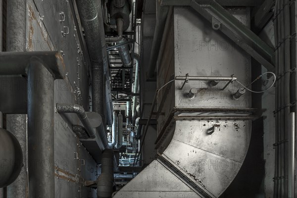 Heating pipes in the power house with boiler plant of a former paper factory