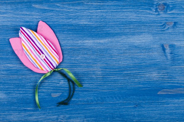 Fabric tulip on blue background