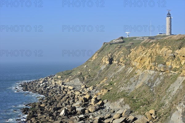 Lighthouse and sandstone boulders from cliff on beach at Cap Gris Nez