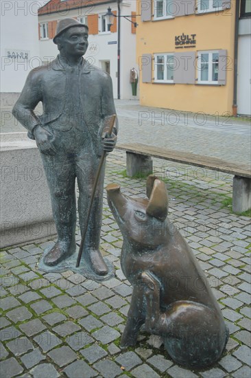Sculptures at the Piggy Fountain with Pig Figure and Man