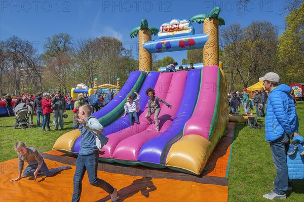 Inflatable plastic slide in springtime Luitpoldpark