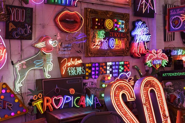 Room full of bright colourful neon signs