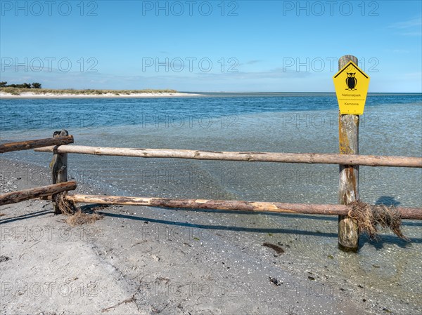 Fence on the beach of the Baltic Sea as the border of the closed-off core zone of the National Park Vorpommersche Boddenlandschaft