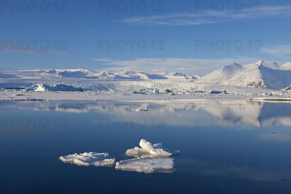 Drift ice floating in Joekulsarlon glacier lagoon in winter