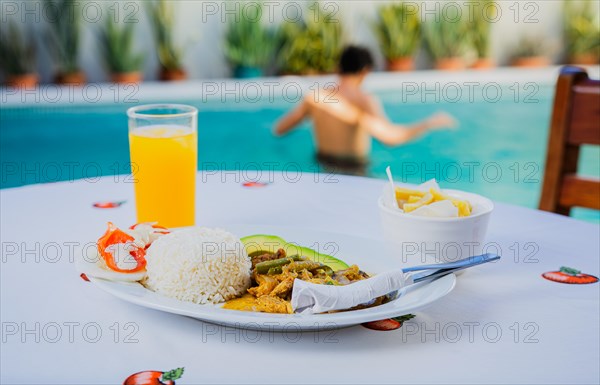 Traditional breakfast served poolside. Traditional morning breakfast near the swimming pool