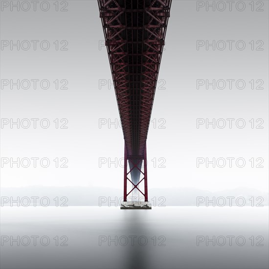 Minimalist long exposure of the Golden Gate Bridge's little sister. The Ponte 25 de Abril bridge over the Tagus River in Lisbon