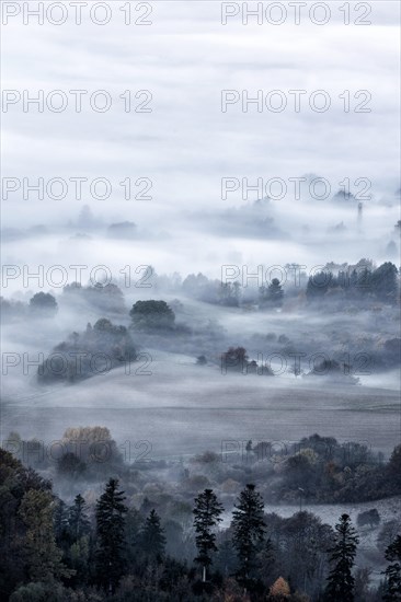 View from the Zeller Horn on misty landscape of the Swabian Alb