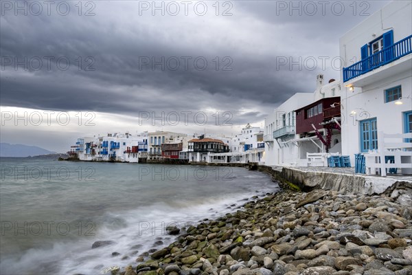 White Cycladic houses on the shore
