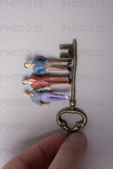 Tiny figurine of man miniature and retro key