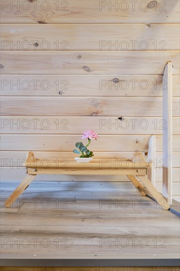 Small bedside wooden breakfast tray on the floor