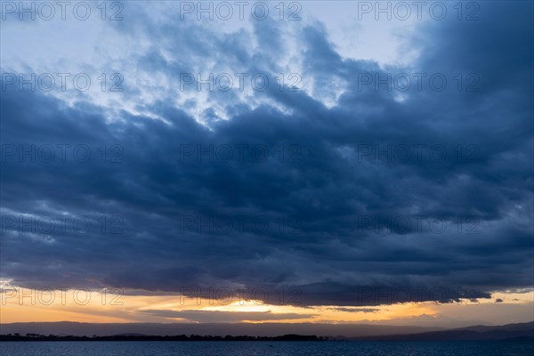 Sea of clouds over a lake