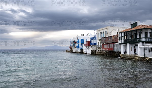 White Cycladic houses on the shore