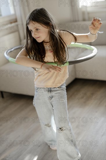 Girl gymnastics with hula hoop