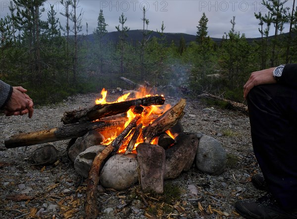 Campfire on a bright night around Midsummer