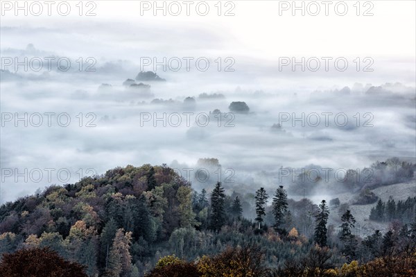 View from the Zeller Horn on misty landscape of the Swabian Alb